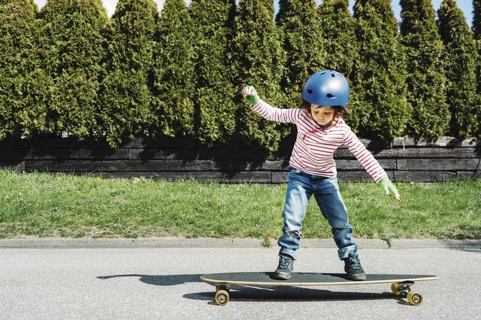 child on skateboard